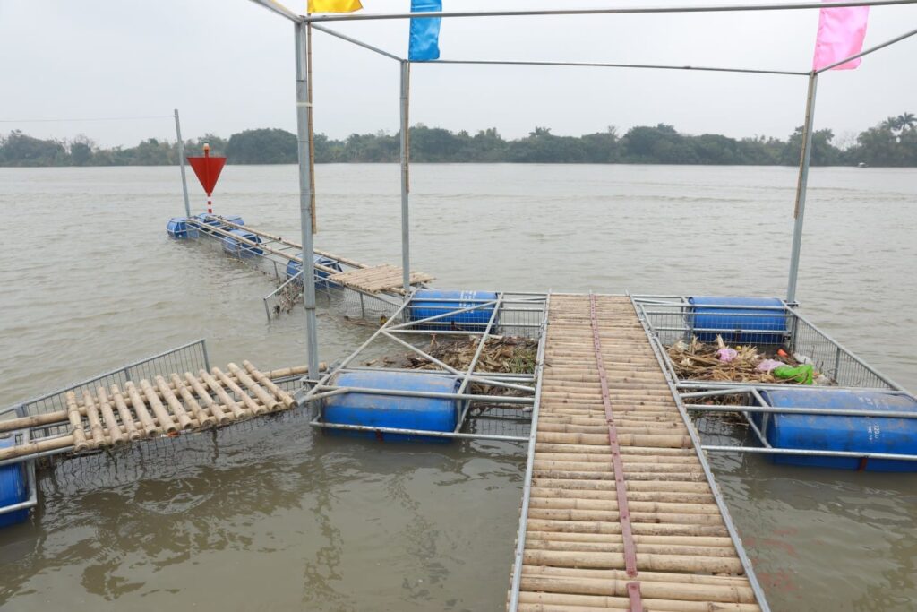 The original garbage trap to collect plastic waste from the Red River in Vietnam